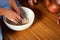 Women hand thresh flour in enameled bowl for make cooking dessert