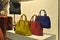 Women handbag and accessories in fashion boutique window display,
