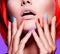 Women hands with bright multicolor nails near face