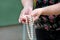 Women hands holding pearl beads jewelery. Closeup of female hand with pearl jewelry. Female hand holding a string of pearl.