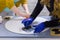 Women hands painting wooden circle