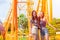 Women happy smile travel in amusement park fun enjoy portrait smiling with friend in theme parks summer season outdoor background