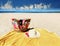 Women hat and  bag   with sunglasses  beachwear clothes on  yellow blanket   beach sand , relaxing sunshine leisure on horizon blu