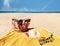 Women hat and  bag   with sunglasses  beachwear clothes on  yellow blanket   beach sand , relaxing sunshine leisure on horizon blu
