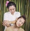 Women is having shoulder massage relaxation