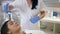 Women Health, happy client female on rejuvenating procedures of facial treatment in spa salon