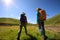 women hiking in riverside mountains