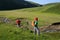 women hiking in riverside mountains