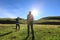 Women hiking in sunrise mountains