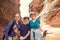 Women hiking together in a red rock canyon