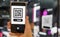 Women hold smartphone in hand, scan store QR code to e- coupon check price receive promotion and discount,cashless society concept