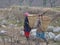 Women holding bamboo basket going for work