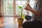 women holding plant and care plant at home