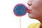 Women holding round swirl lollipop colorful