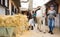 Women horse ranchers preparing horse for ride