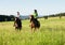 Women Horseback Riding in a Landscape