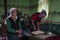 Women inside a yourt near the Karakul Lake, in the Xinjiang Province