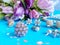 Women jewelry pink opan and white pearl  with tulips Bouquet   flowers petal  on blue  accessory background