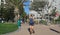 Women jogging with mask on in a sunny public park