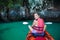 Women are kayaking in the sea caves at the Krabi shore, Thailand