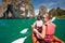 Women are kayaking in the sea caves at the Krabi shore, Thailand