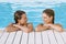 Women Leaning At Poolside