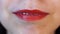 Women lips close-up. Red Lips Closeup in Studio Cheeky Mouth