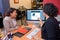 Women looking at image piano on computer screen