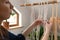 Women making macrame in a beautiful sunny day in attic. Stay at home hobbies