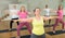 Women making yoga at gym. Virabhadrasana pose