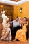 Women and man in traditional flamenco dresses dance during the Feria de Abril on April Spain