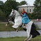 Women in medieval clothes on a horse