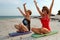 Women meditation on beach