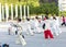 Women and men in the street in the Park gymnastics WUSHU.