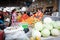 Women negotiating prices at main market bazaar, one of them is picking vegetables to buy