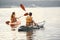 Women paddling on a lake in a kayak