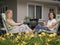 Women on Patio Framed by Flowers