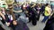 Women penitents in Lenten garb carrying scepter