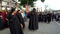 Women penitents in Lenten garb carrying scepter.