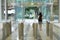 Women people walking out from security at an entrance gate with key card access control smart office building