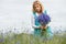 Women picking blue flowers