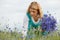 Women picking blue flowers