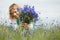 Women picking blue flowers