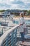 Women on pier near beach with roofed wicker chairs in Travemuende at the Baltic Sea. Travepromenade in Travemunde, a