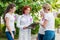 women with pink ribbons looking at doctor with clipboard breast cancer awareness