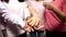 Women in pink shirts putting hands together, support, gender equality, feminism