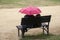 Women with pink umbrella