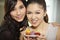 Women with a plate of macaroons. Conceptual image