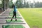 Women player golf swing shot on course