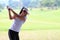 Women player golf swing shot on course
